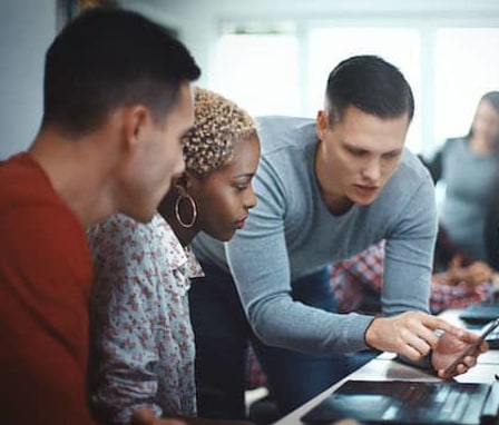 Colleagues working together on a laptop computer