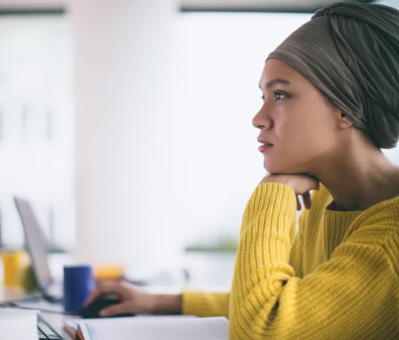 Woman using desktop computer in office